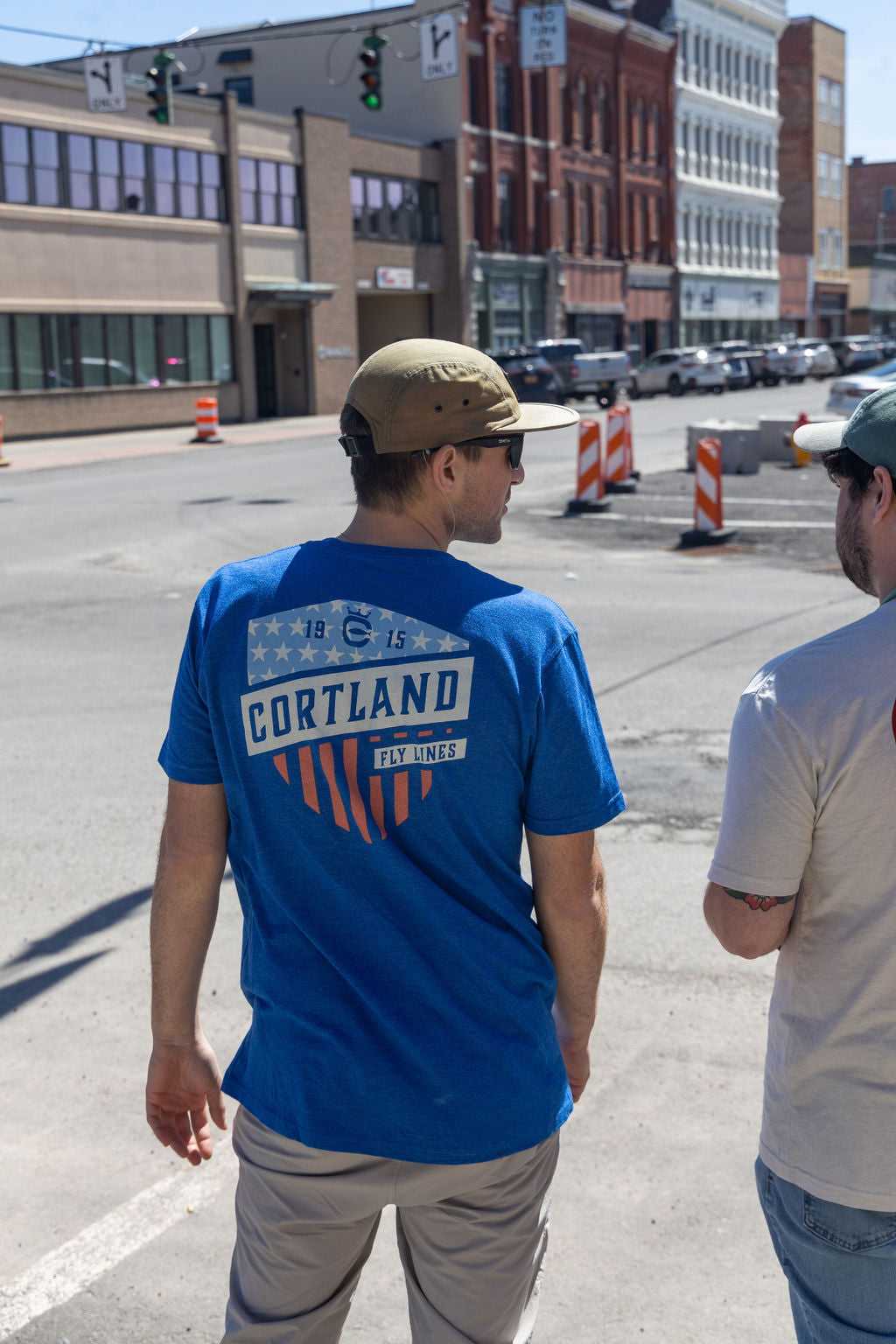 Two guys with their backs towards the camera 