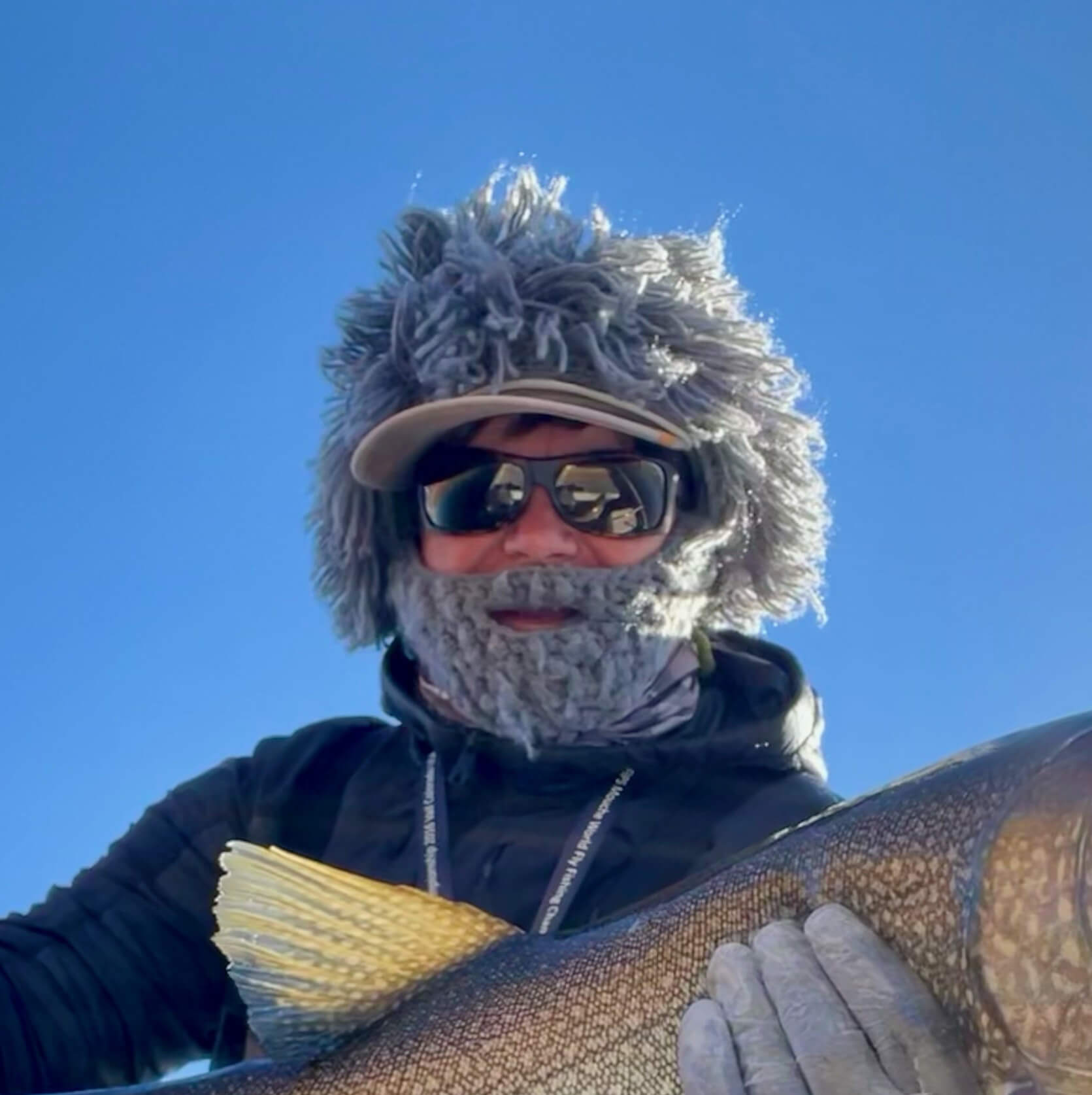 Charles Card wearing sunglasses and a winter hat