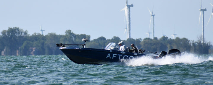 Boat on Lake Erie with wind mills in the background
