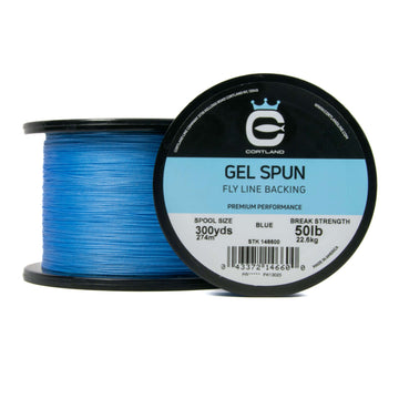 Two Spools of Gel Spun Fly Line Backing - Blue. One spool is facing the camera show casing the logo and packaging. The other is on its side. 