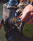 Someone holding onto a variety of spools of Ultra Premium Fluorocarbon Tippet