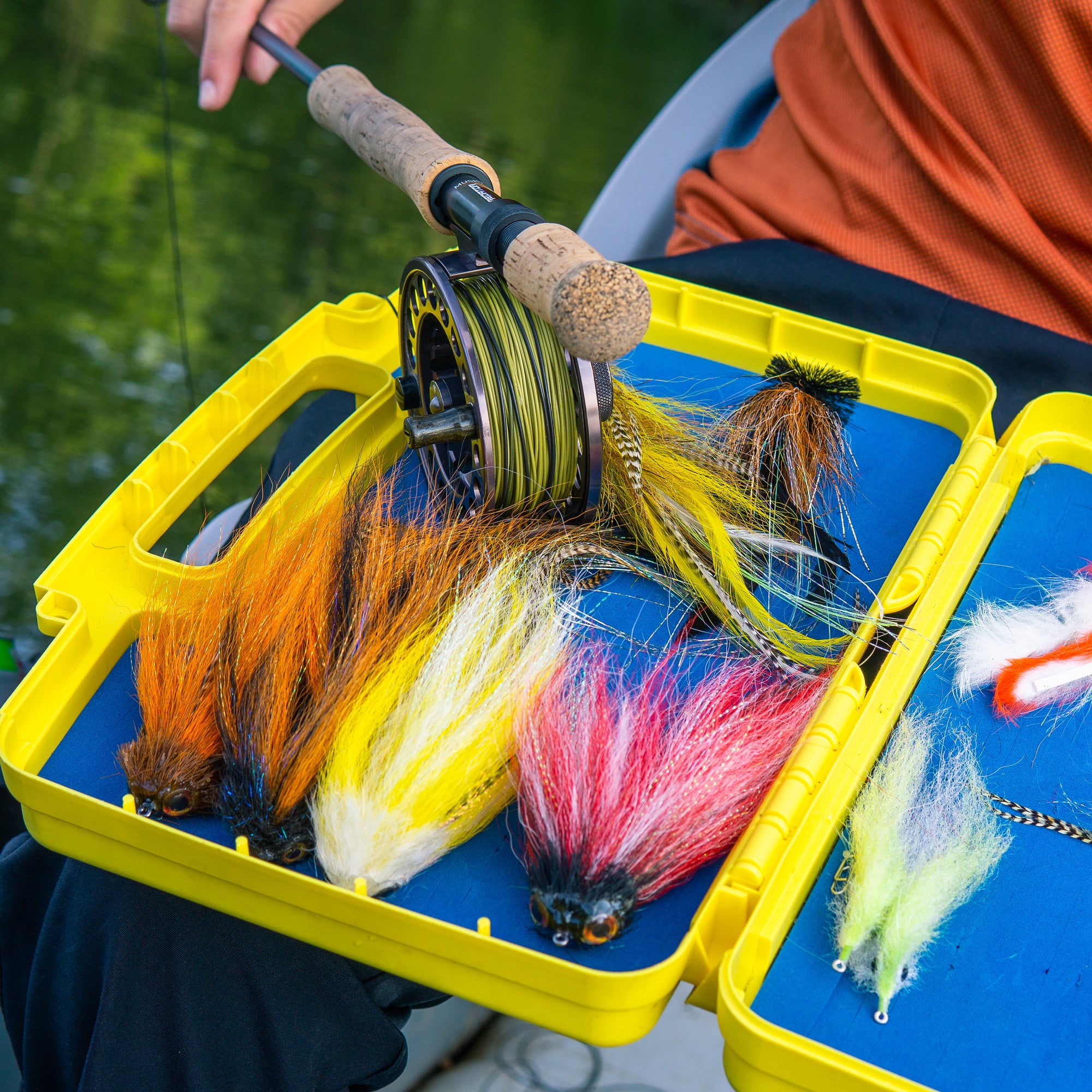 Closeup of a tackle box with various fly fishing flies